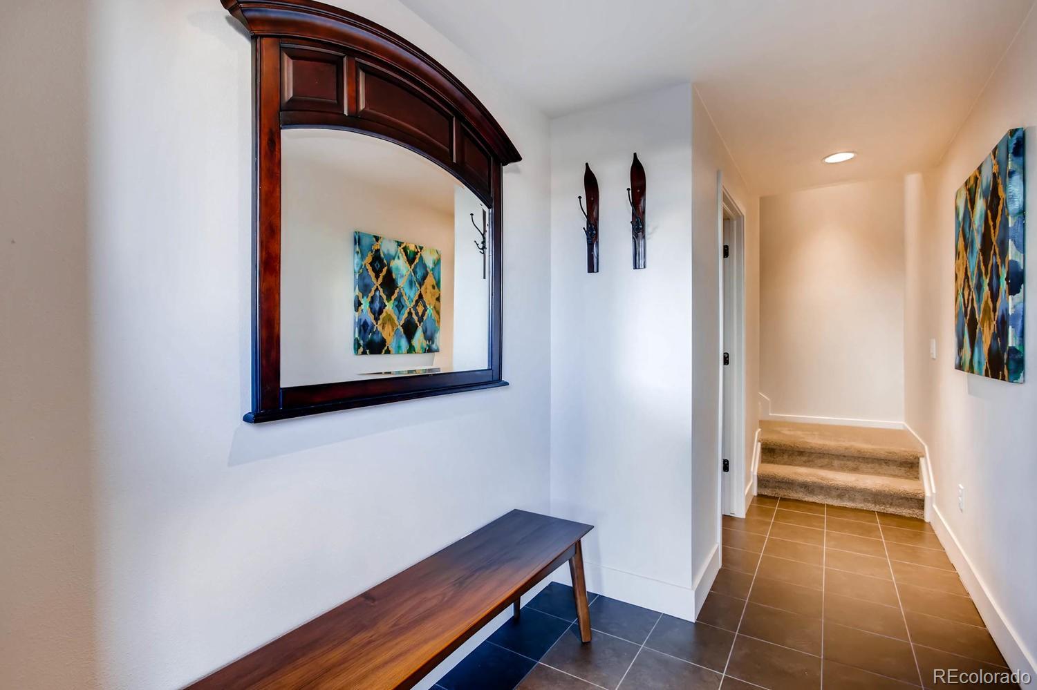 3435 Cranston Circle Highlands Ranch, CO 80126 - Photo 31 of 40 a hallway with a large window and a rug