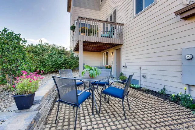 a view of a patio with furniture