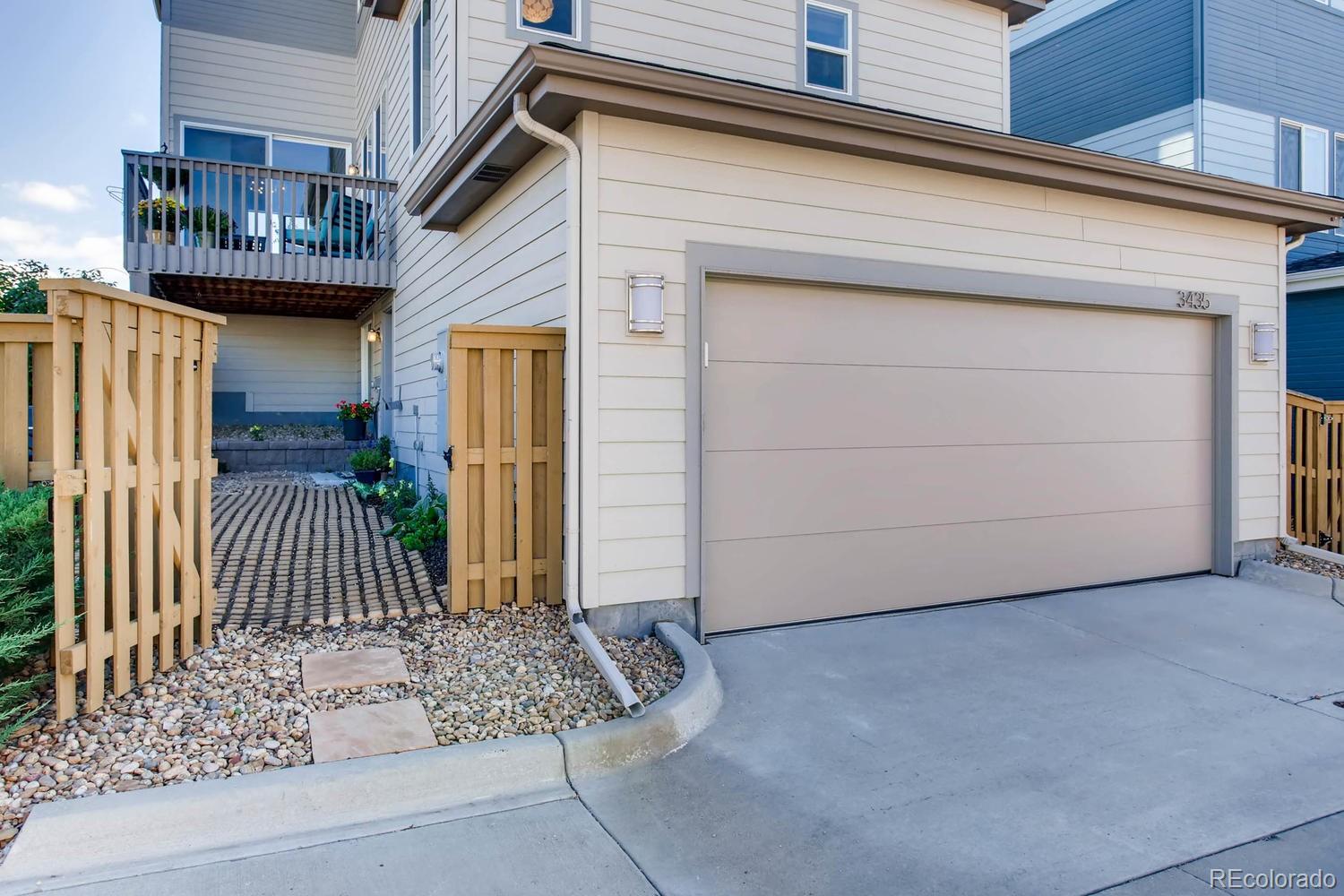 3435 Cranston Circle Highlands Ranch, CO 80126 - Photo 38 of 40 a view of a house with a door and wooden bench