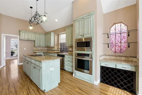 a kitchen with a stove oven and a refrigerator