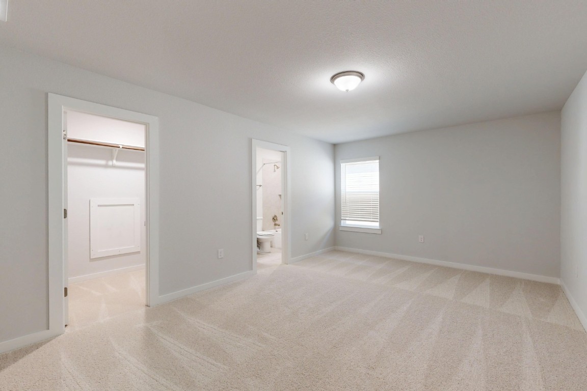 2029 Billings Way Leander, TX 78641 - Photo 23 of 29 an empty room with windows and closet