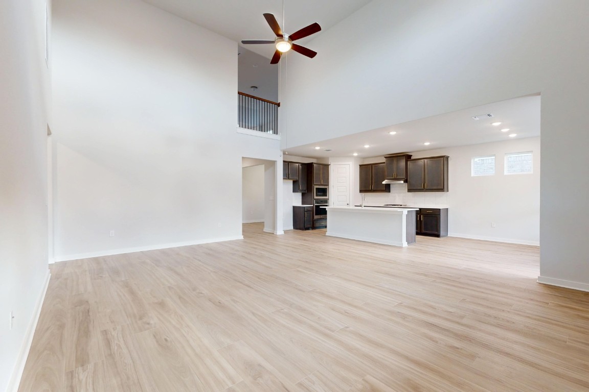2029 Billings Way Leander, TX 78641 - Photo 5 of 29 a view of a kitchen with a sink and a refrigerator