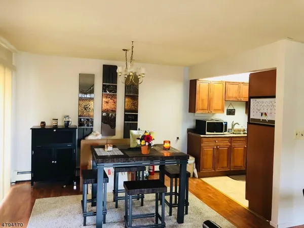 a kitchen with a table and chairs in it