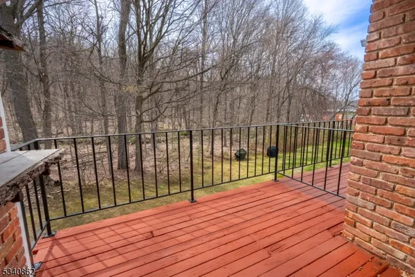 a view of balcony with wooden floor