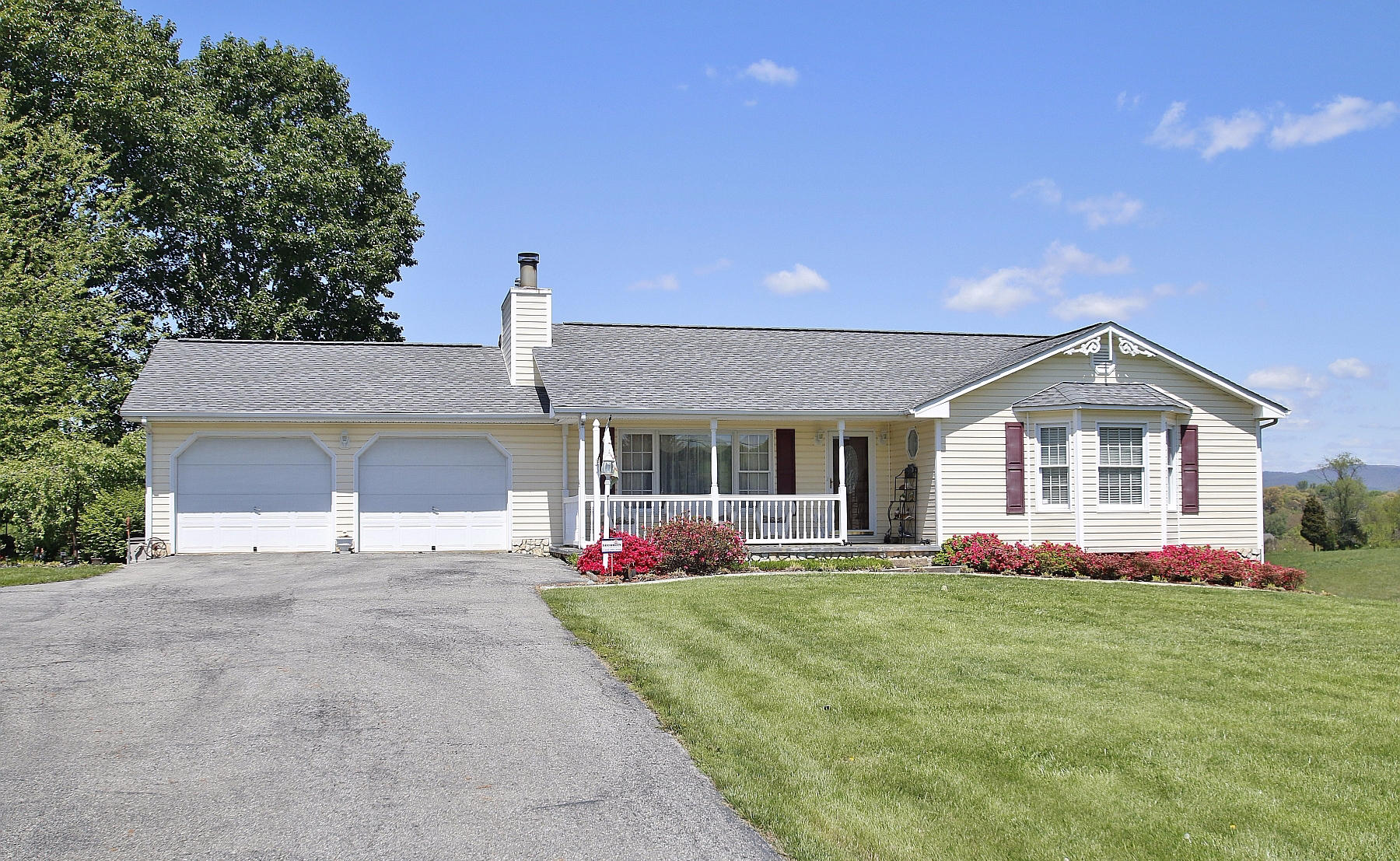 1883 Mill Iron Road Goodview, VA 24095 - Photo 1 of 56 a front view of house with yard and garage
