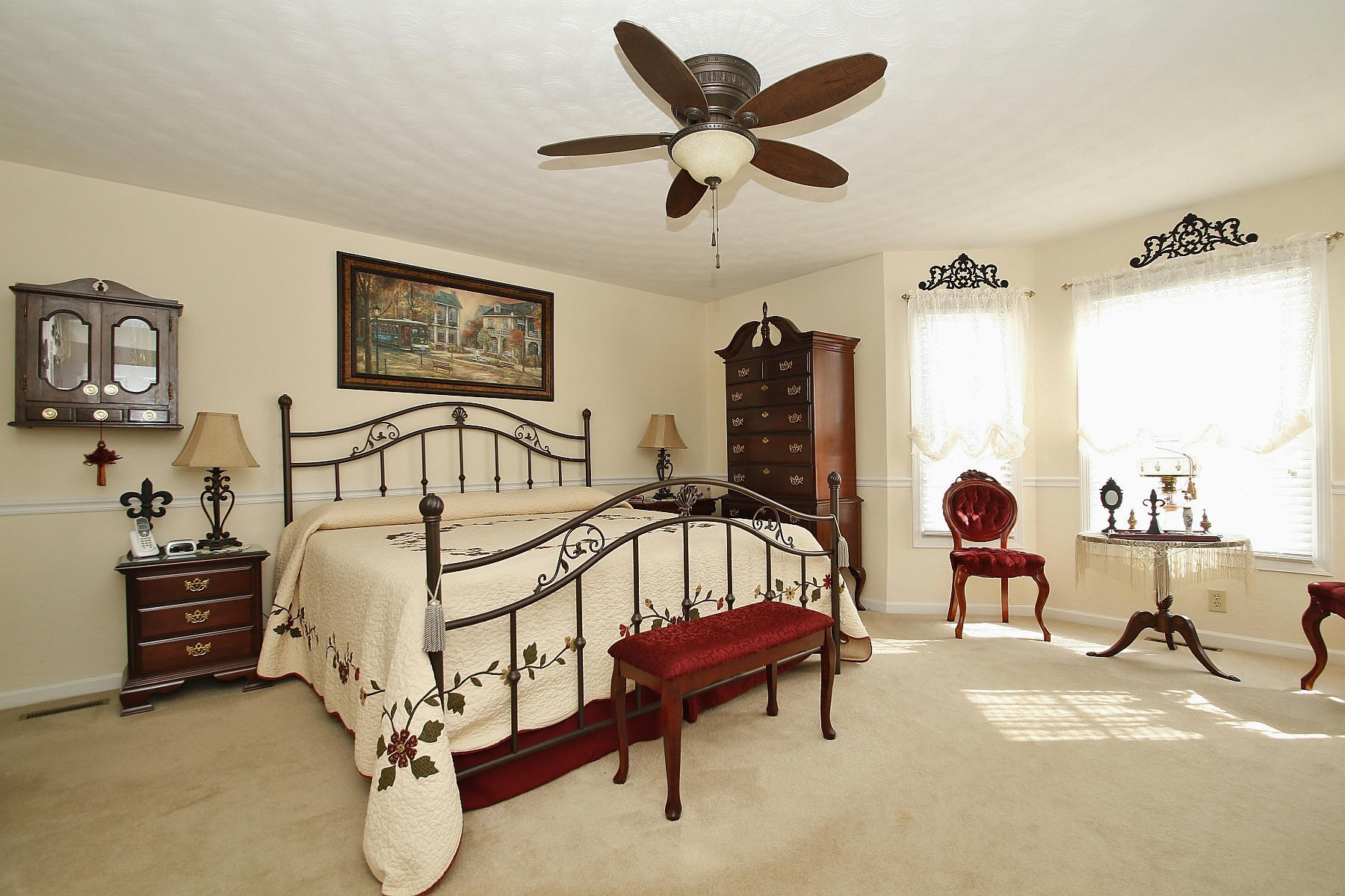 1883 Mill Iron Road Goodview, VA 24095 - Photo 17 of 56 a bedroom with a bed and a chandelier