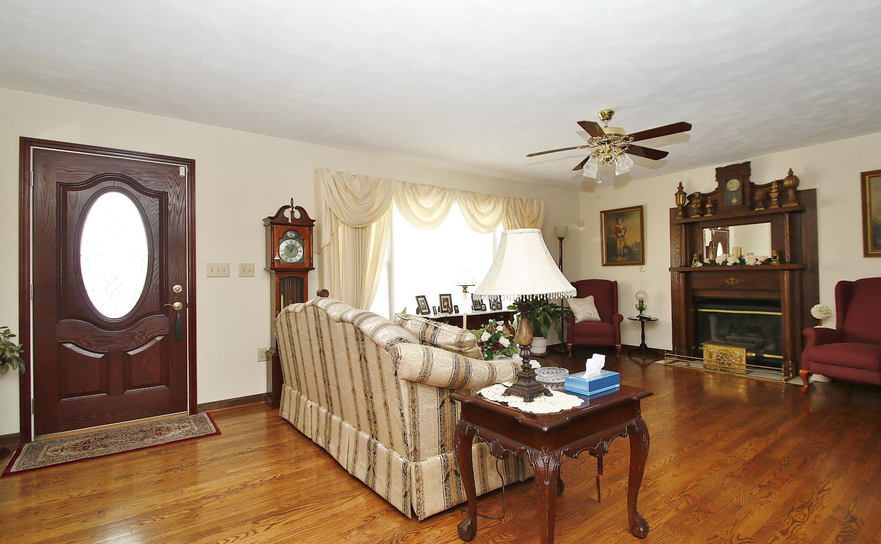 1883 Mill Iron Road Goodview, VA 24095 - Photo 4 of 56 a living room with furniture a fireplace and a large window