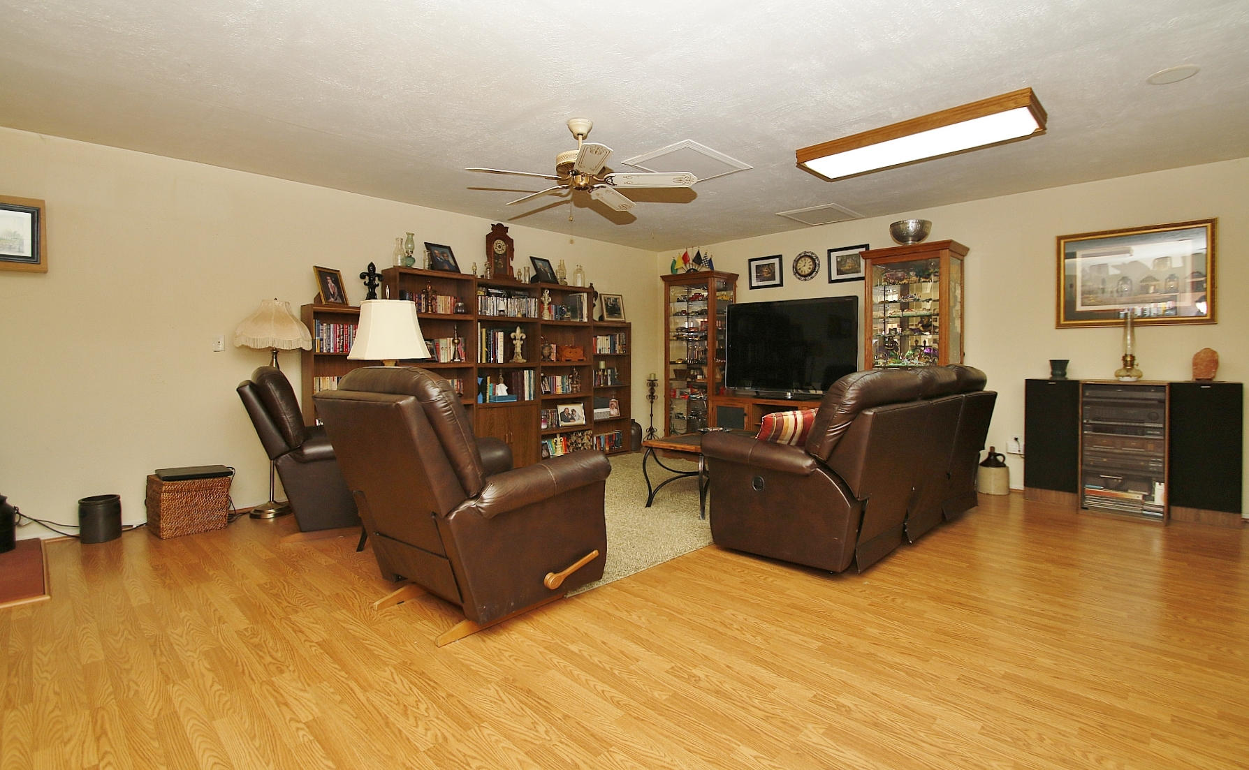1883 Mill Iron Road Goodview, VA 24095 - Photo 38 of 56 a living room with furniture and a flat screen tv