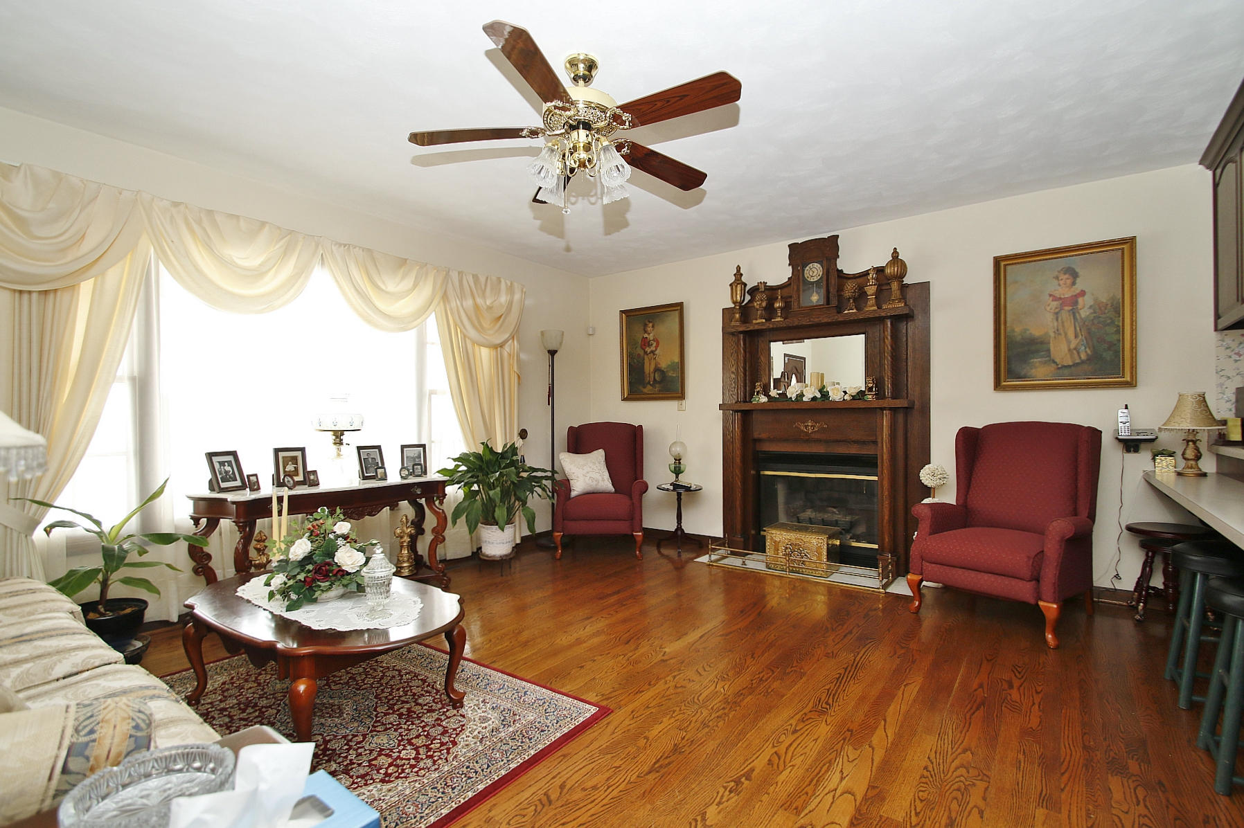 1883 Mill Iron Road Goodview, VA 24095 - Photo 5 of 56 a living room with furniture a fireplace and a large window