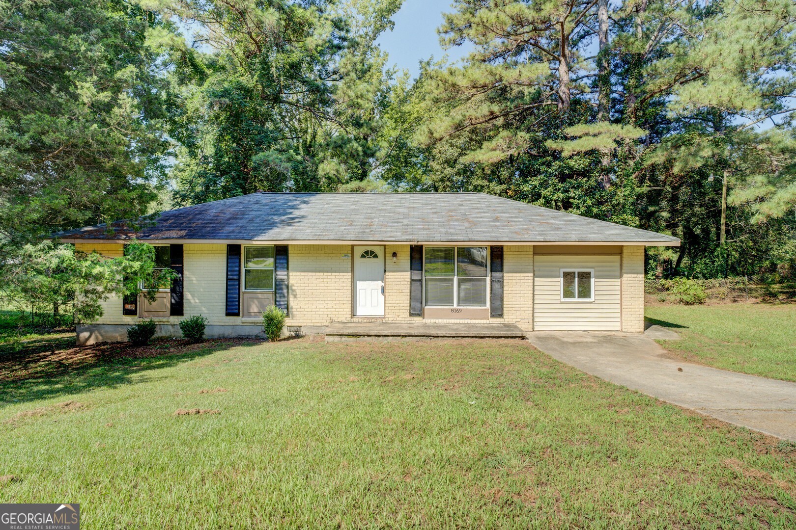 8169 Kendrick Road Jonesboro, GA 30238 - Photo 1 of 1 front view of a house with a yard