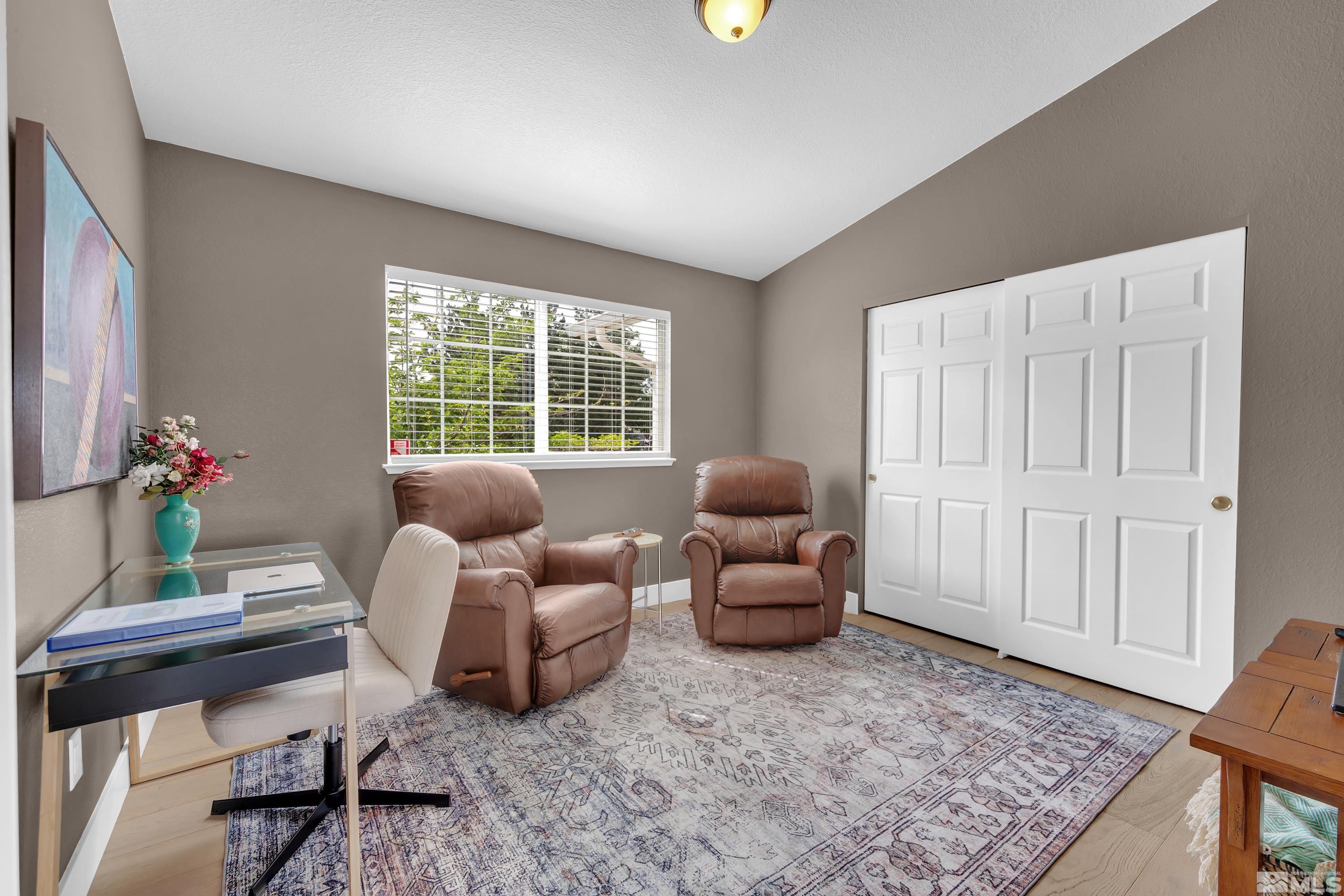 962 University Ridge Court Reno, NV 89512 - Photo 16 of 40 a living room with furniture and a window