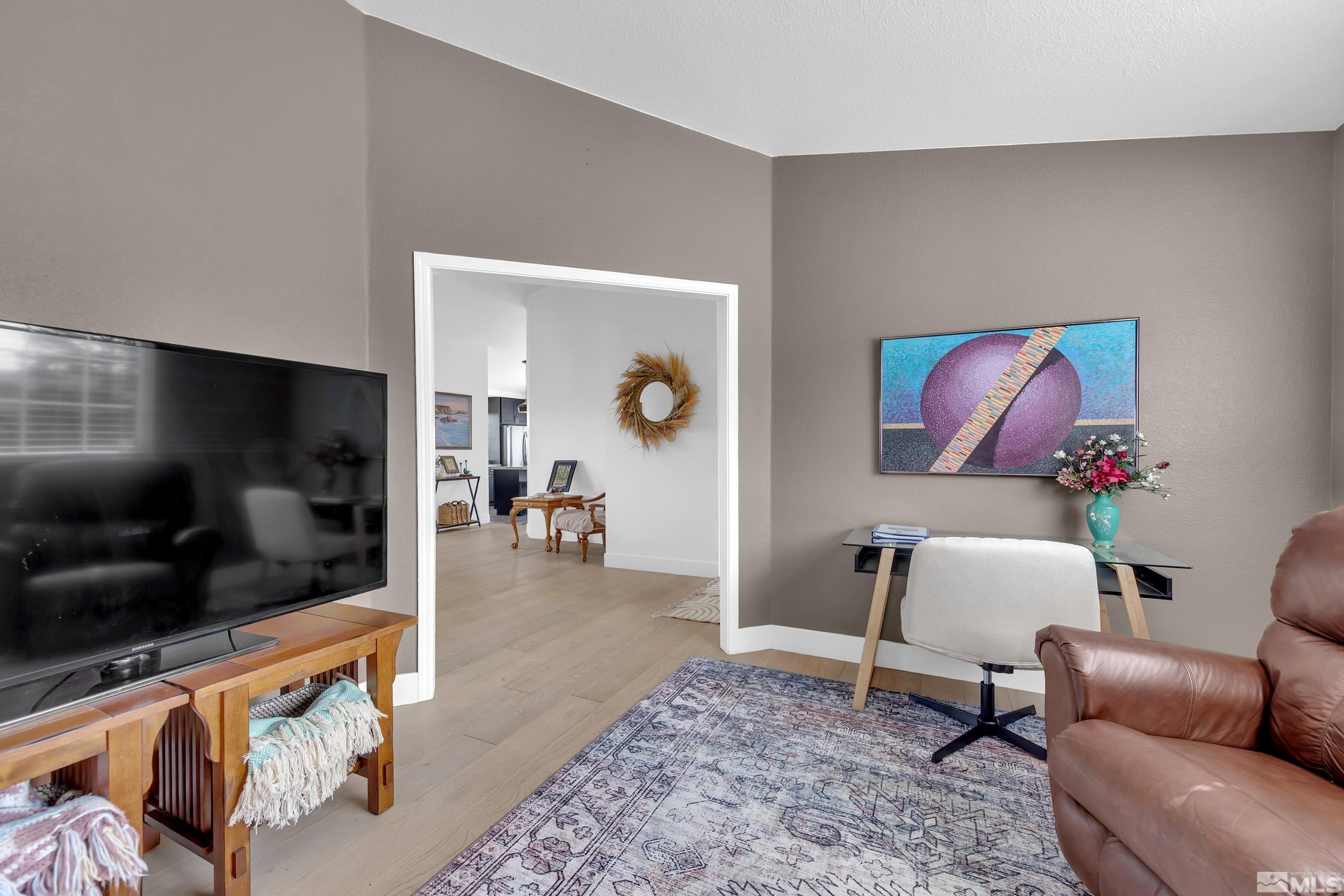 962 University Ridge Court Reno, NV 89512 - Photo 17 of 40 a living room with furniture and a flat screen tv