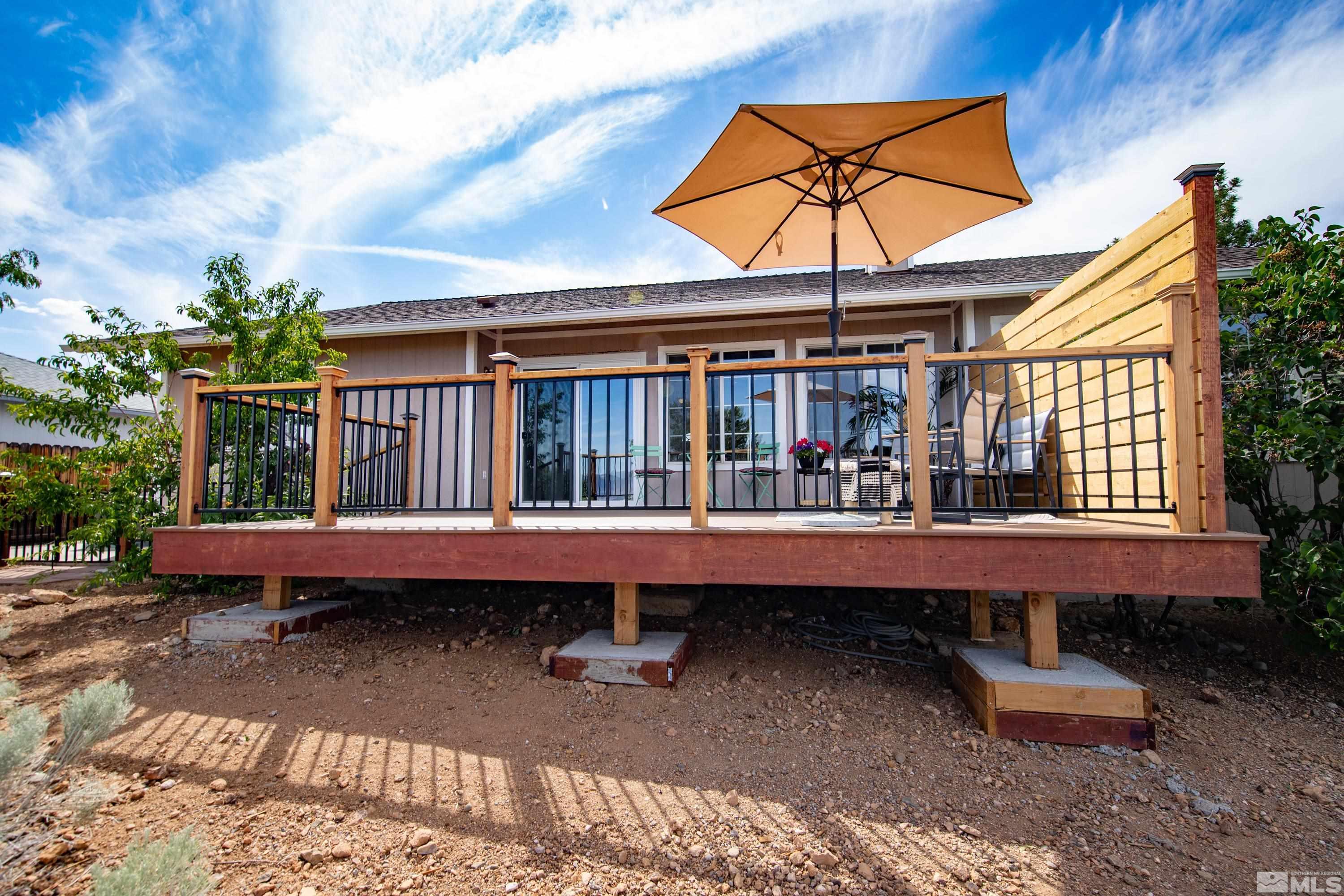 962 University Ridge Court Reno, NV 89512 - Photo 20 of 40 a backyard of a house with outdoor seating