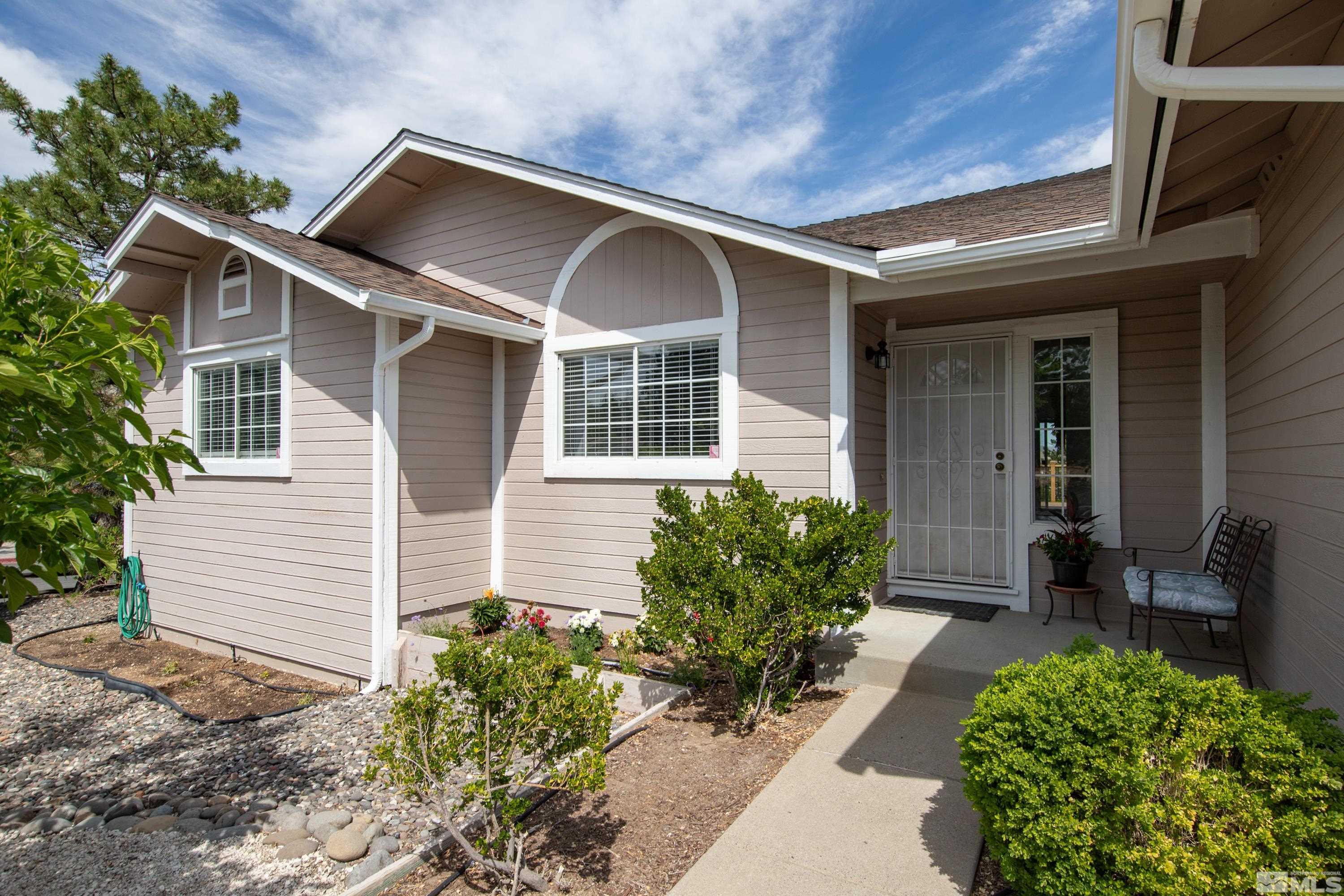 962 University Ridge Court Reno, NV 89512 - Photo 22 of 40 a front view of a house with garden