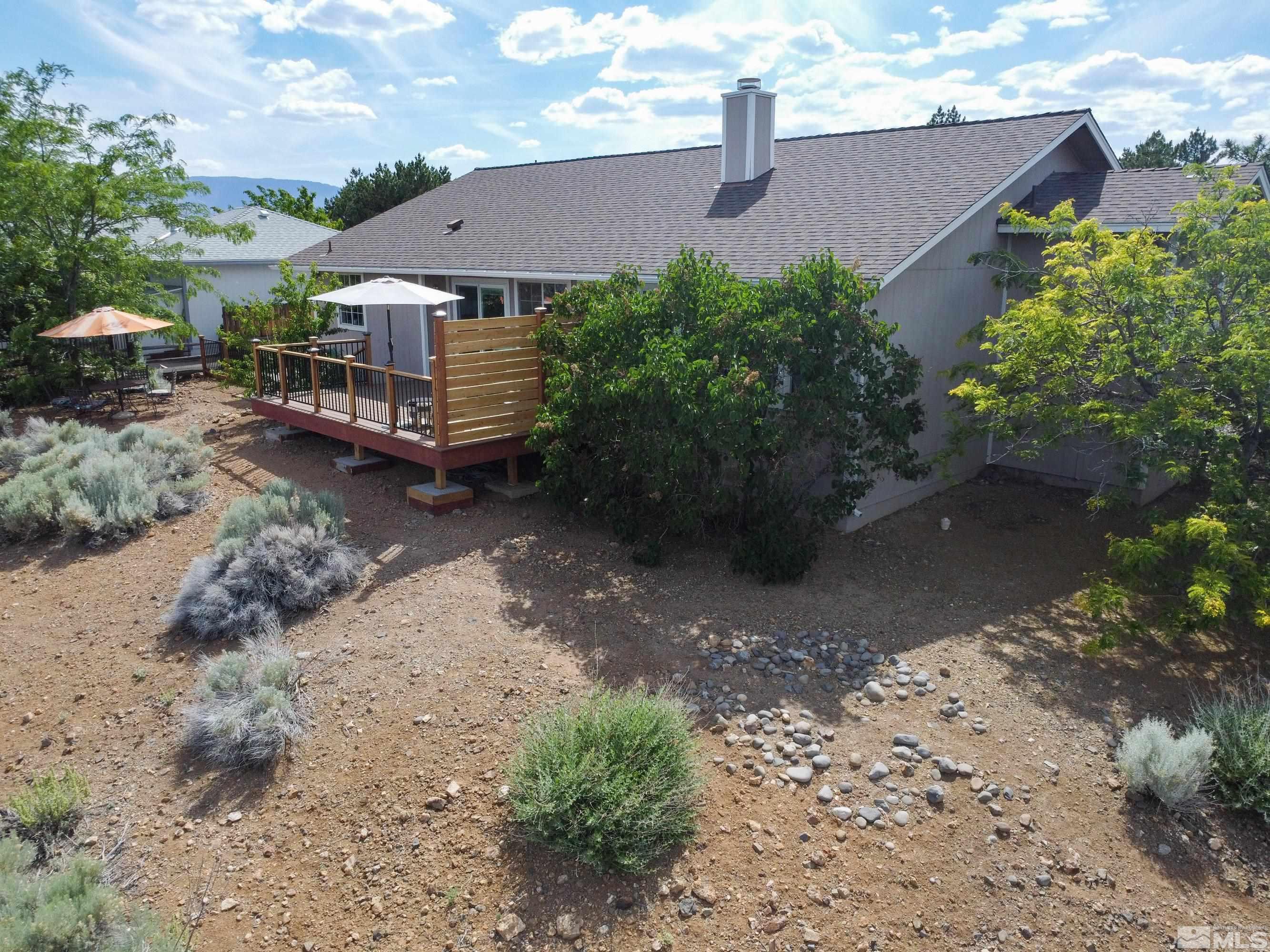 962 University Ridge Court Reno, NV 89512 - Photo 23 of 40 a view of a house with a yard and plants