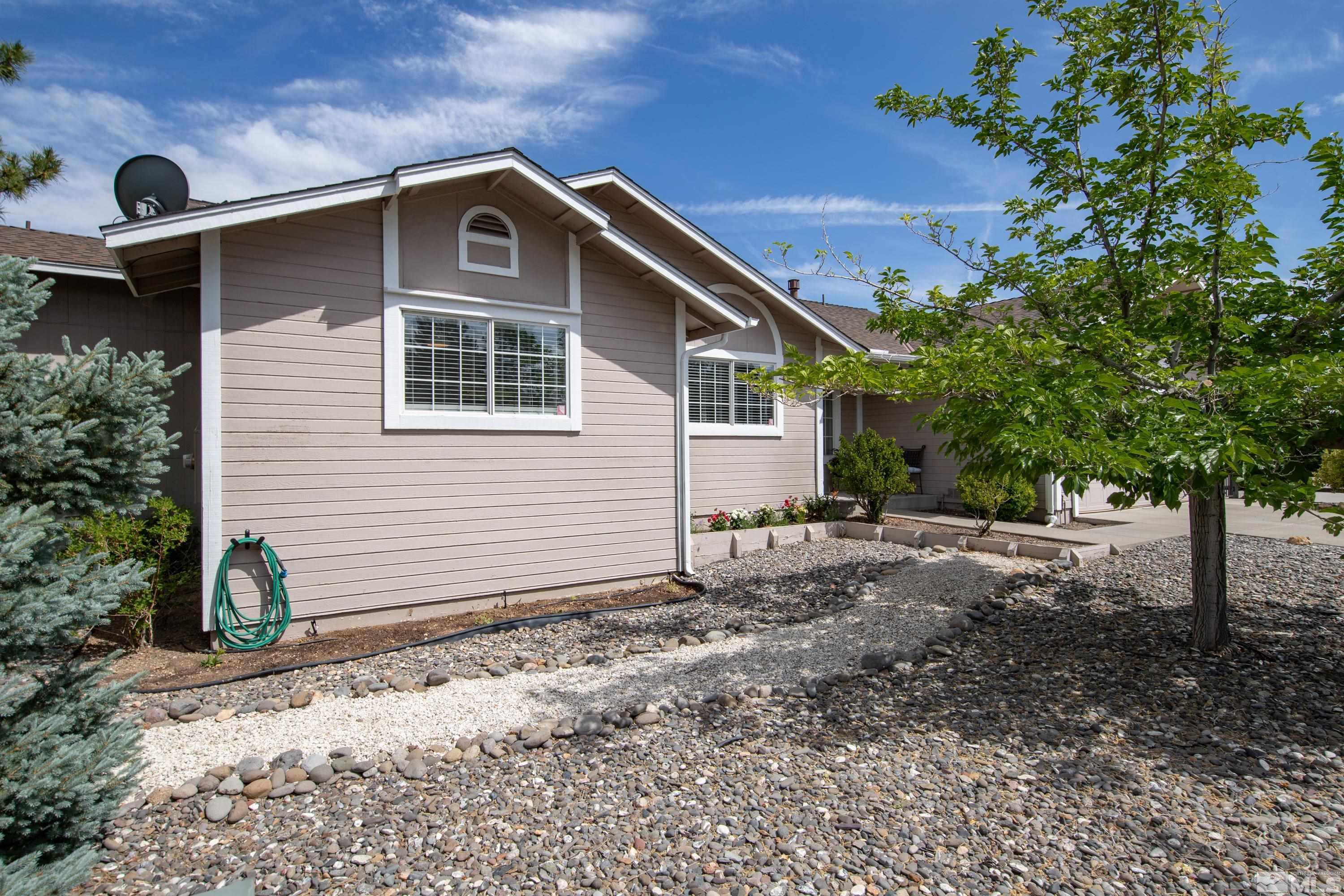 962 University Ridge Court Reno, NV 89512 - Photo 26 of 40 a front view of a house with garden