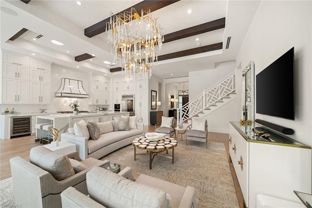 150 6th Street North Naples, FL 34102 - Photo 4 of 46 a living room with furniture and a flat screen tv