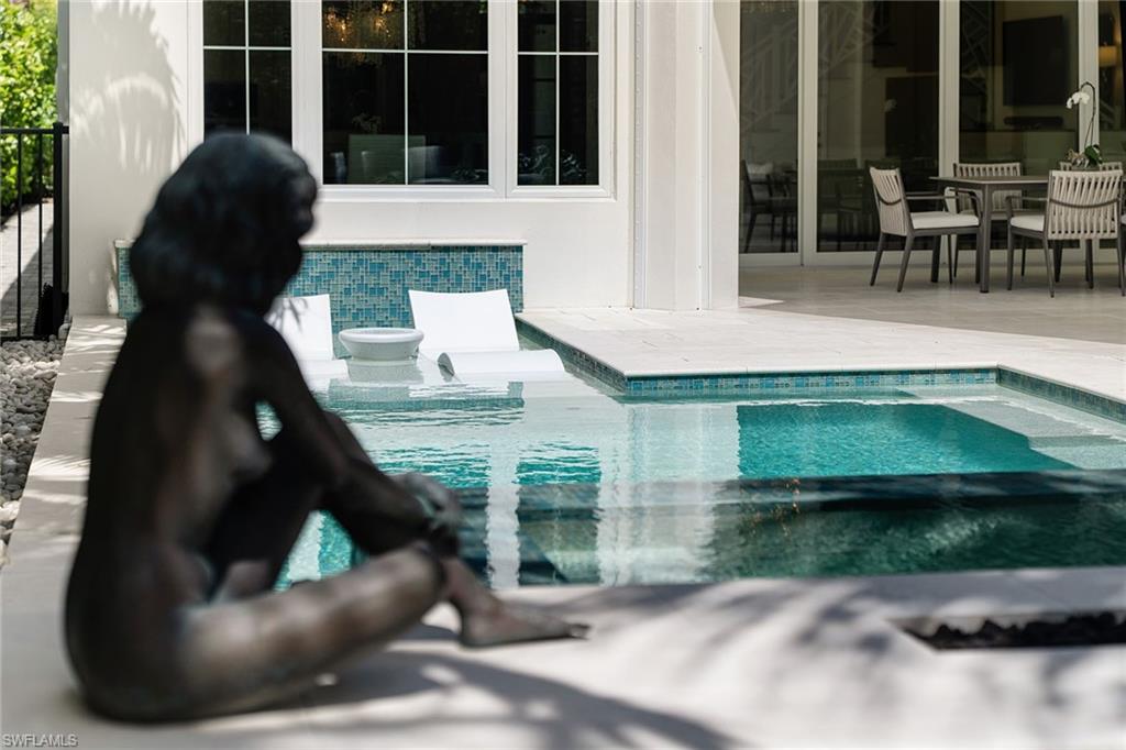 150 6th Street North Naples, FL 34102 - Photo 43 of 46 a view of backyard with outdoor seating