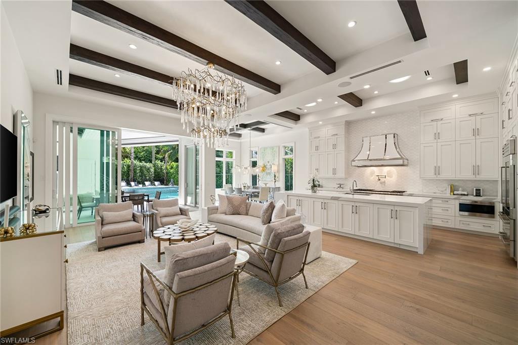 150 6th Street North Naples, FL 34102 - Photo 5 of 46 a living room with furniture and a large window