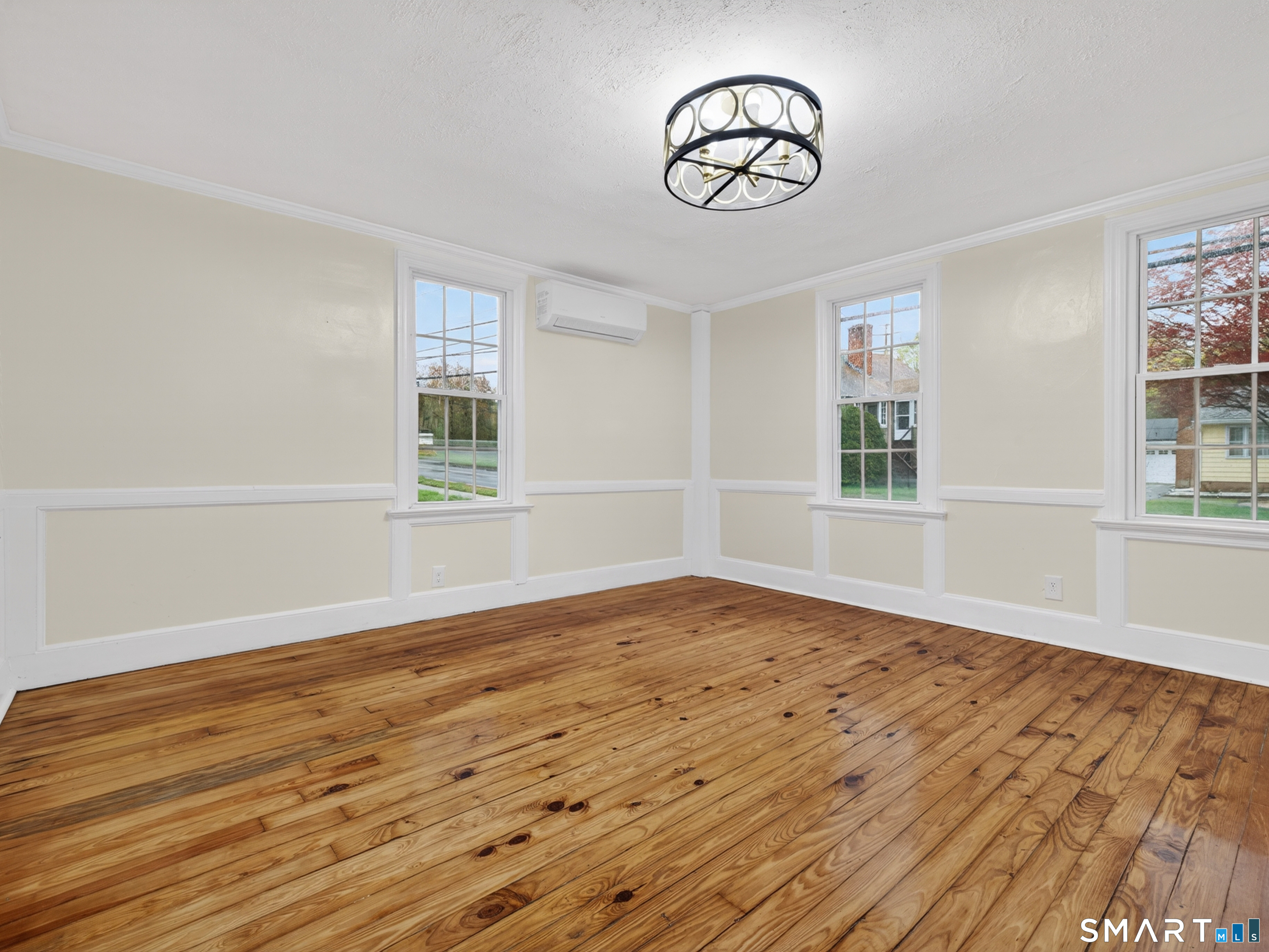 380 Main Street Meriden, CT 06451 - Photo 13 of 40 a view of empty room with wooden floor and fan