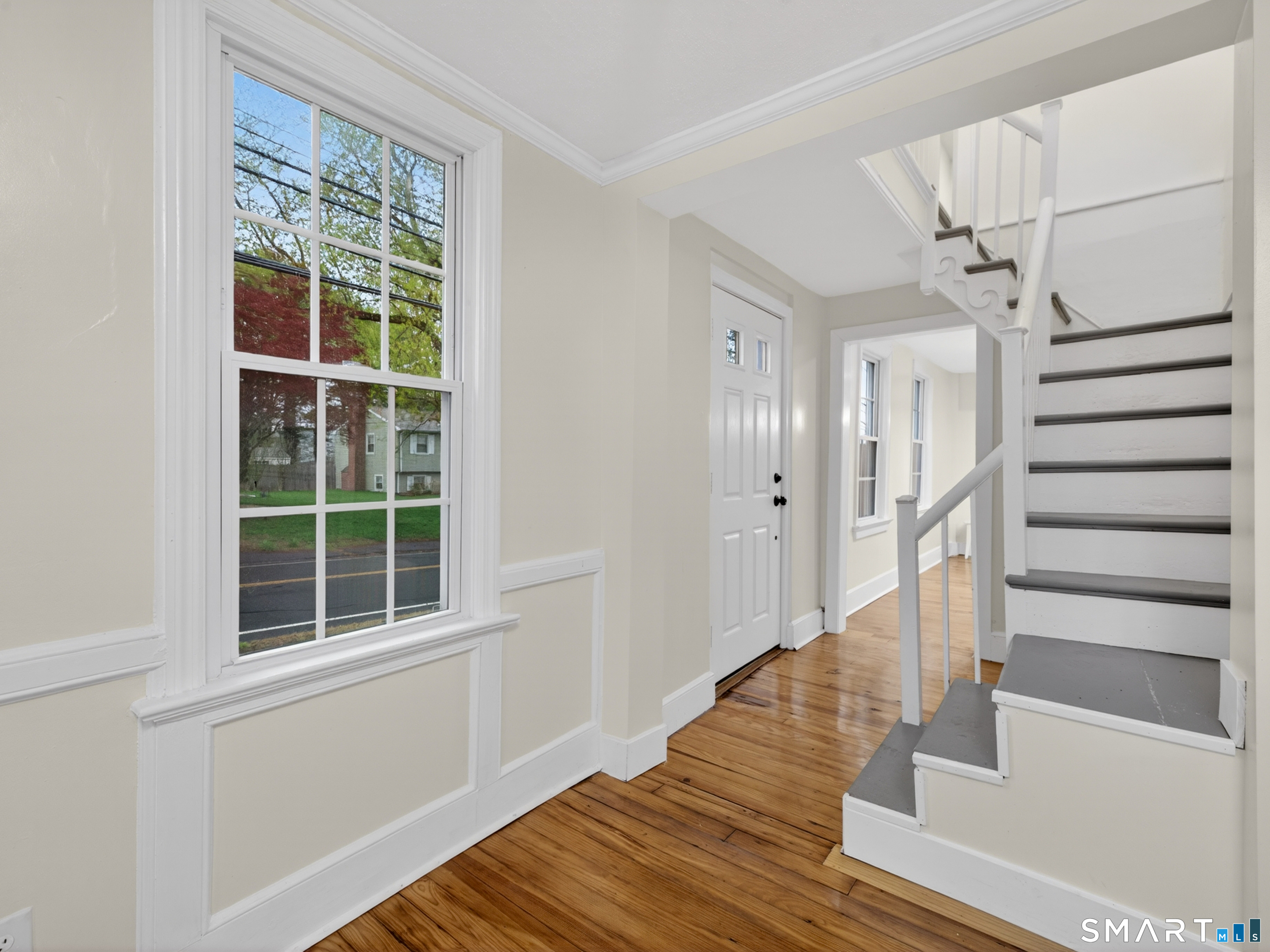 380 Main Street Meriden, CT 06451 - Photo 18 of 40 a view of front door with wooden floor and stairs