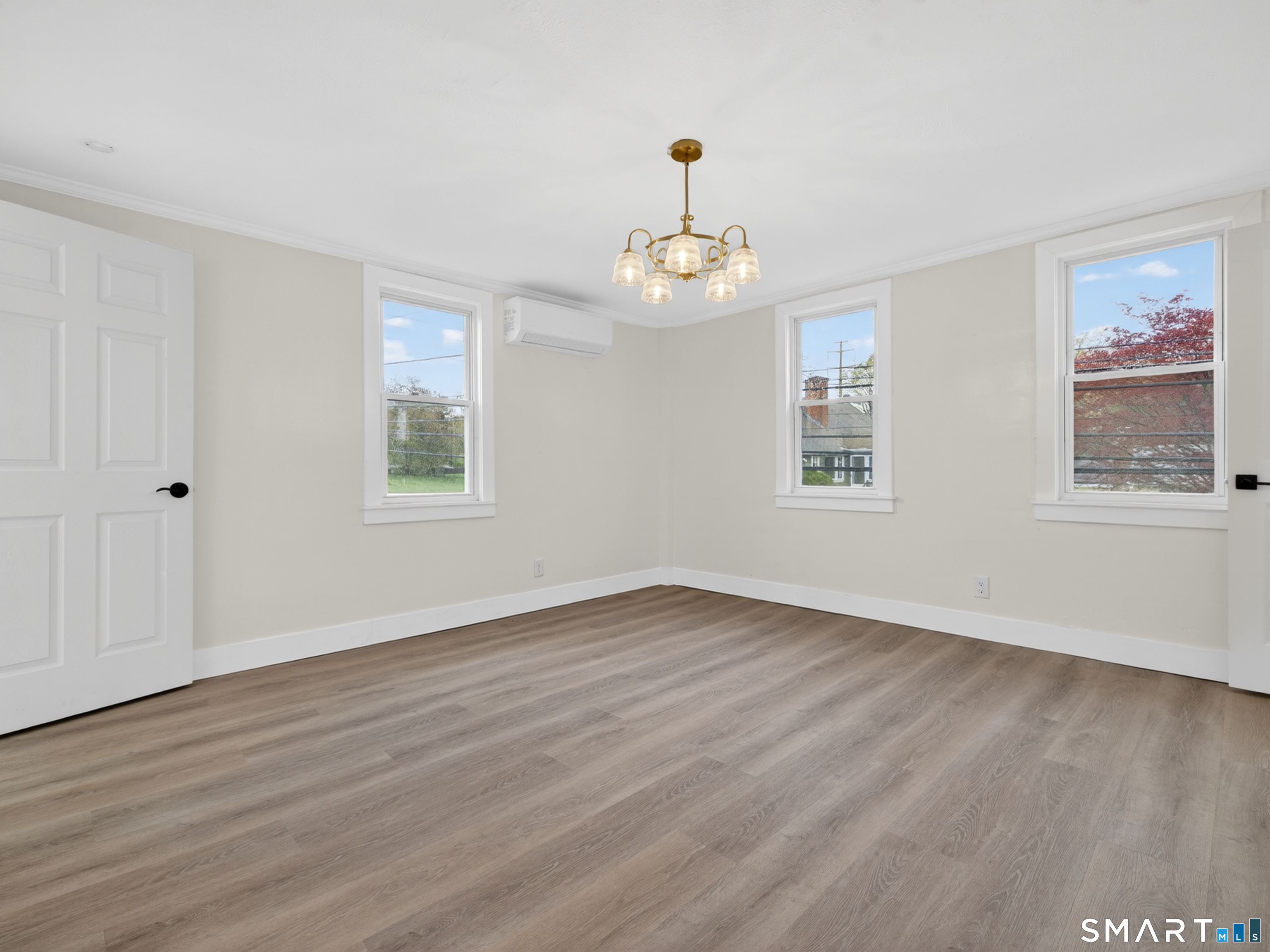 380 Main Street Meriden, CT 06451 - Photo 25 of 40 a view of an empty room with wooden floor and a window
