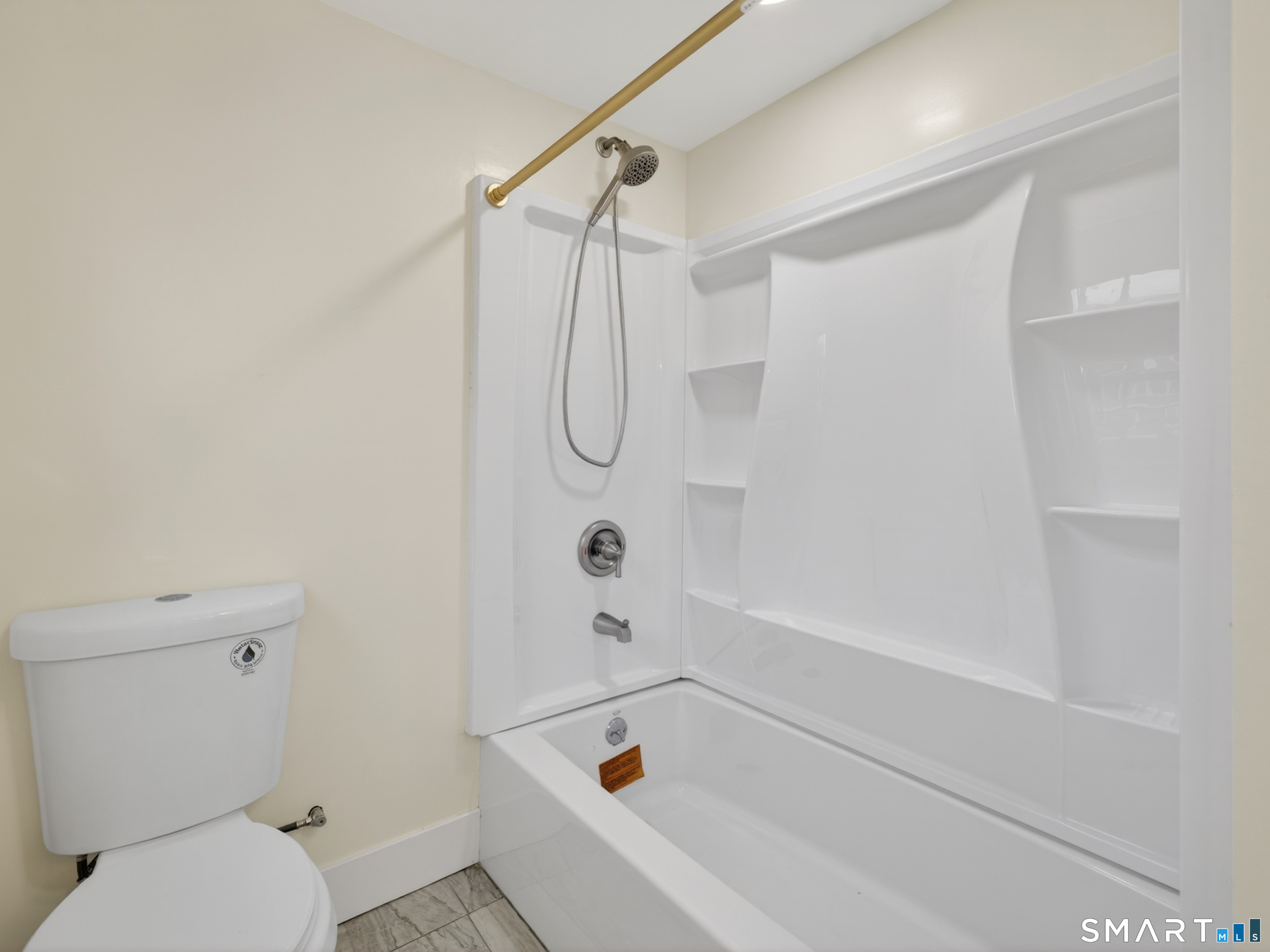 380 Main Street Meriden, CT 06451 - Photo 27 of 40 a bathroom with a bathtub and a shower
