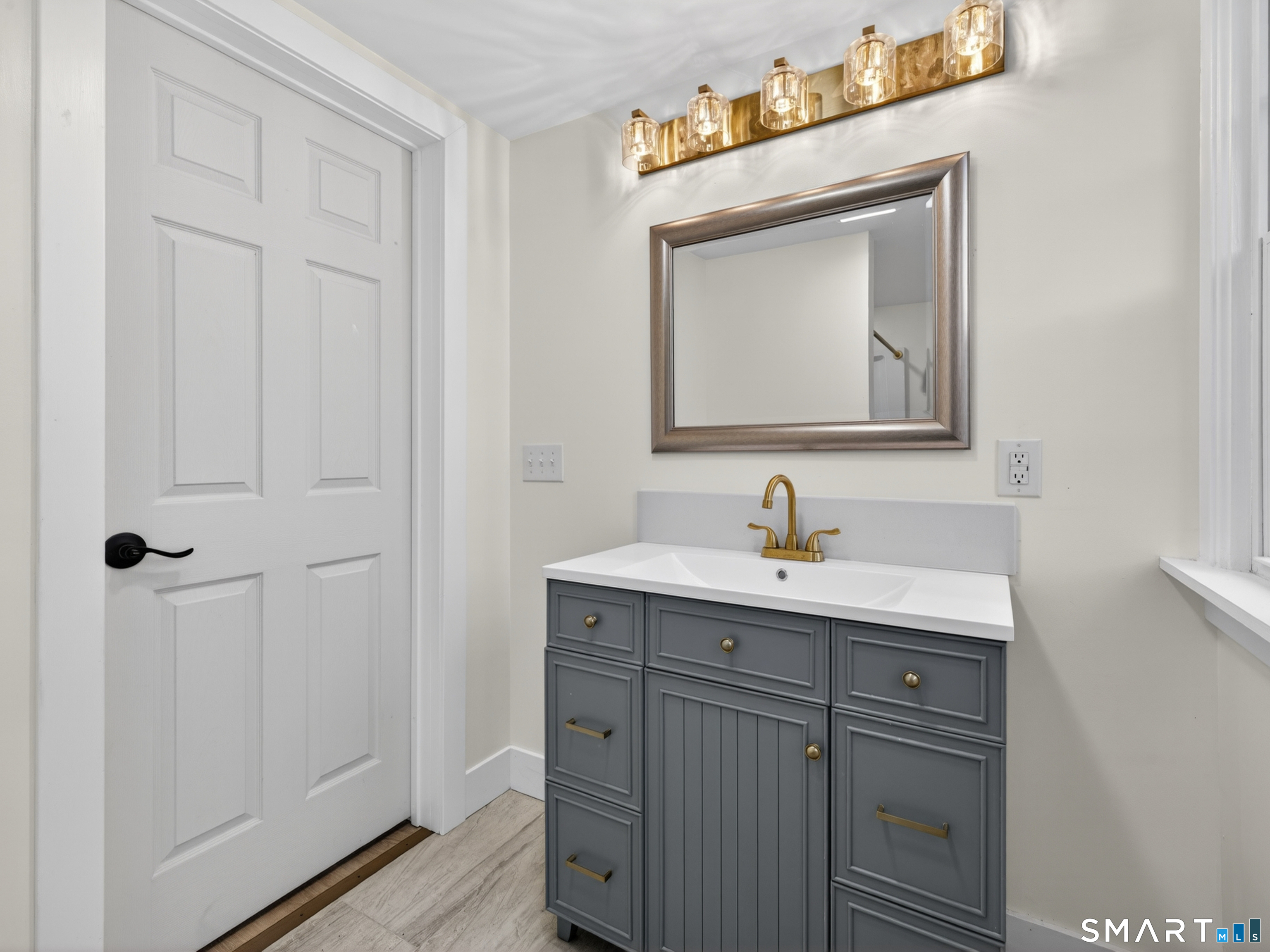 380 Main Street Meriden, CT 06451 - Photo 28 of 40 a bathroom with a sink a vanity and a mirror