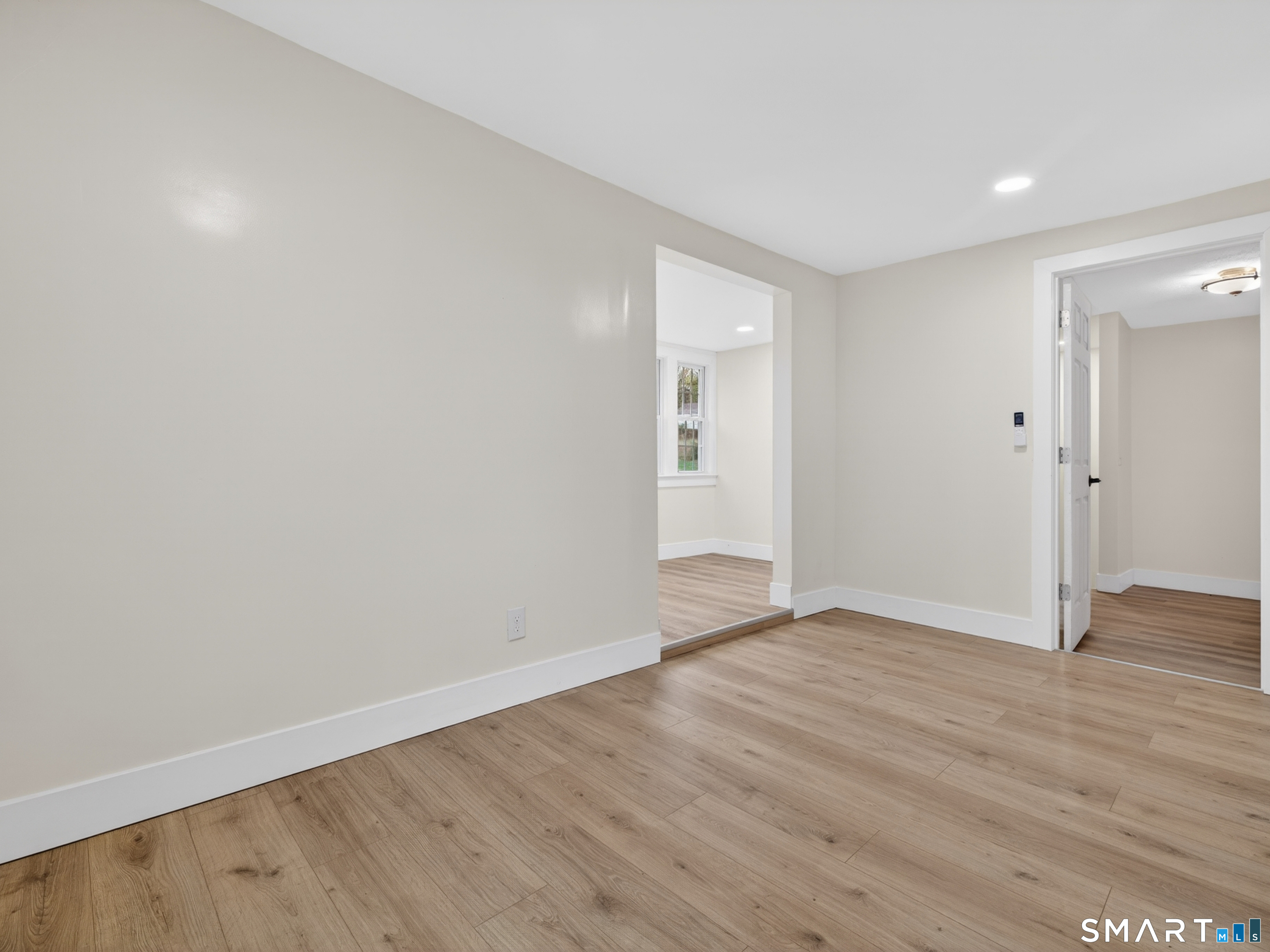 380 Main Street Meriden, CT 06451 - Photo 29 of 40 a view of an empty room with wooden floor