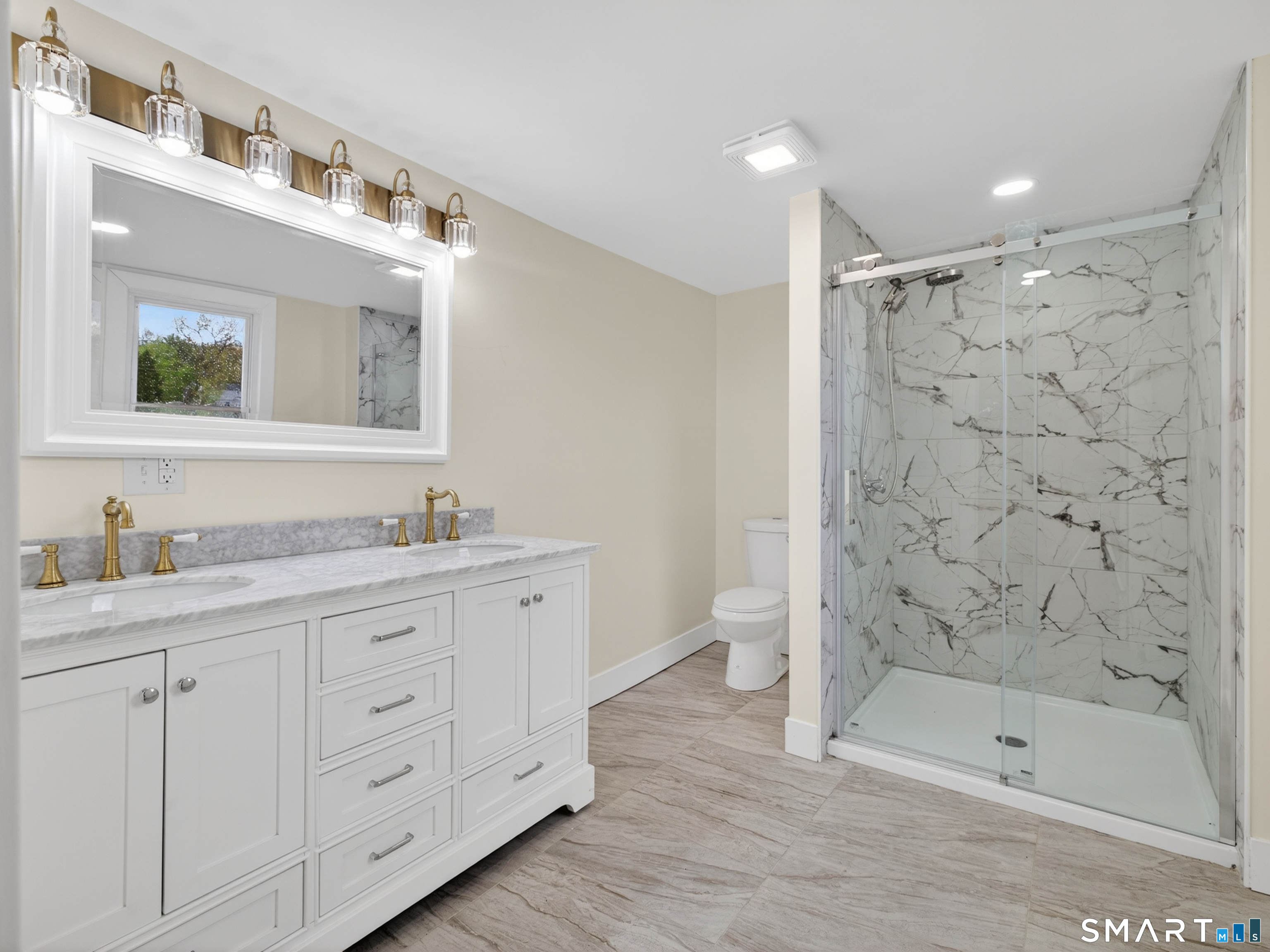 380 Main Street Meriden, CT 06451 - Photo 31 of 40 a bathroom with a granite countertop sink mirror and shower