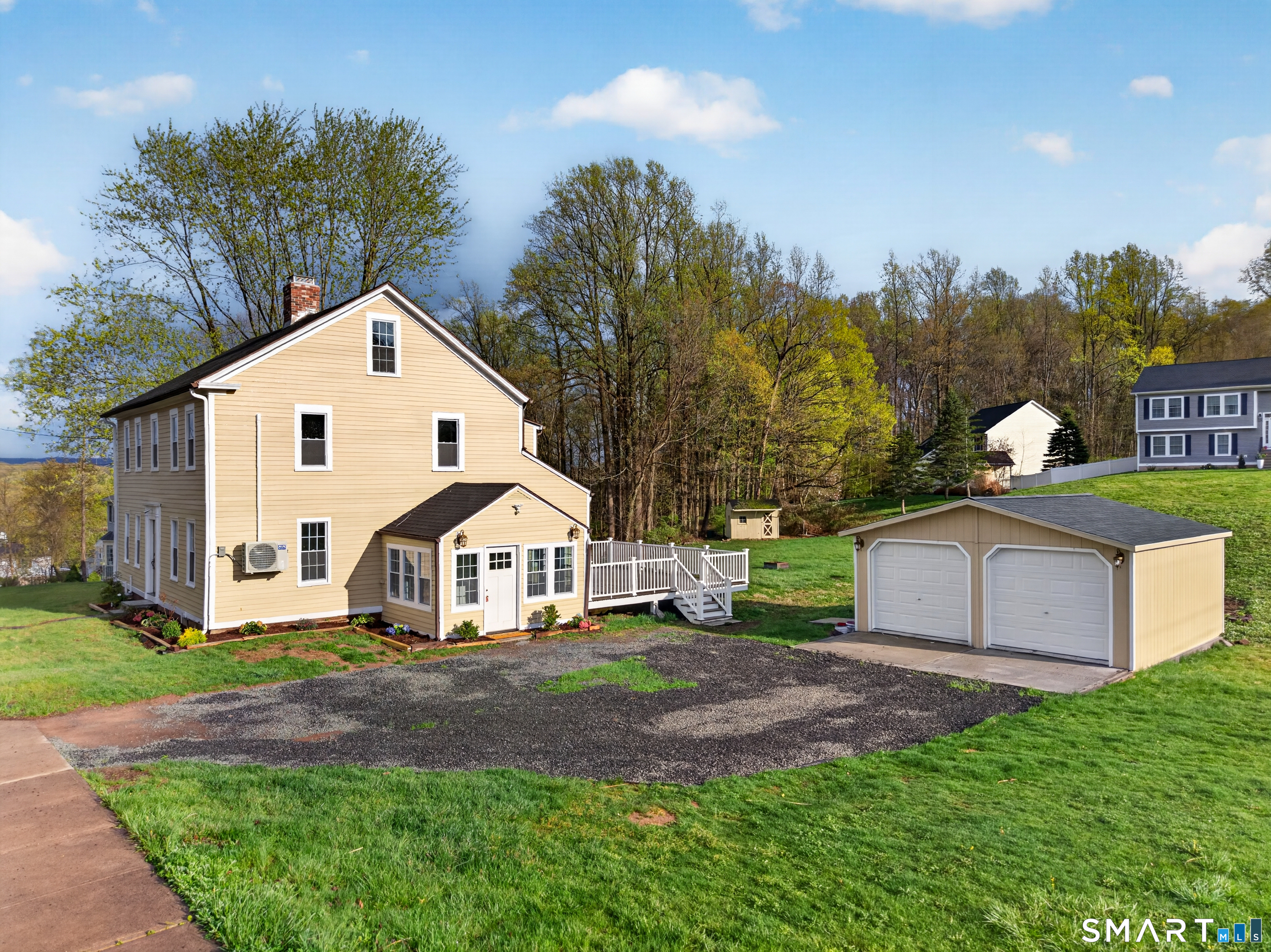 380 Main Street Meriden, CT 06451 - Photo 35 of 40 a front view of a house with a yard and trees
