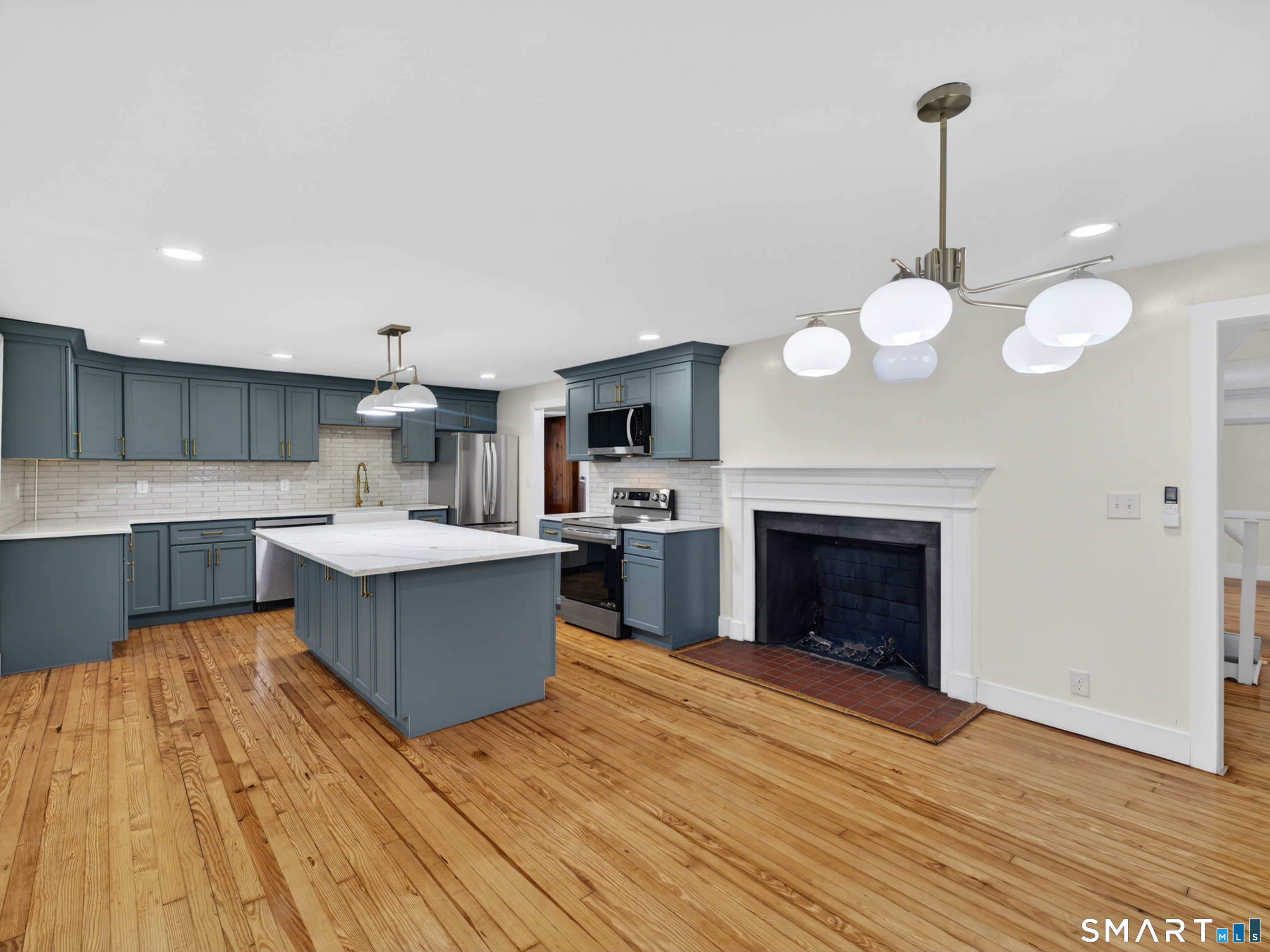 380 Main Street Meriden, CT 06451 - Photo 9 of 40 a large kitchen with cabinets a sink and a stove