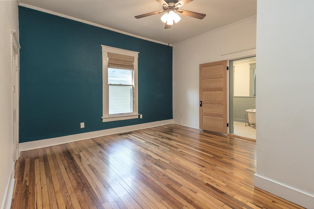 119 South Fenwick Road Memphis, TN 38111 - Photo 21 of 28 a view of an empty room with wooden floor and a window