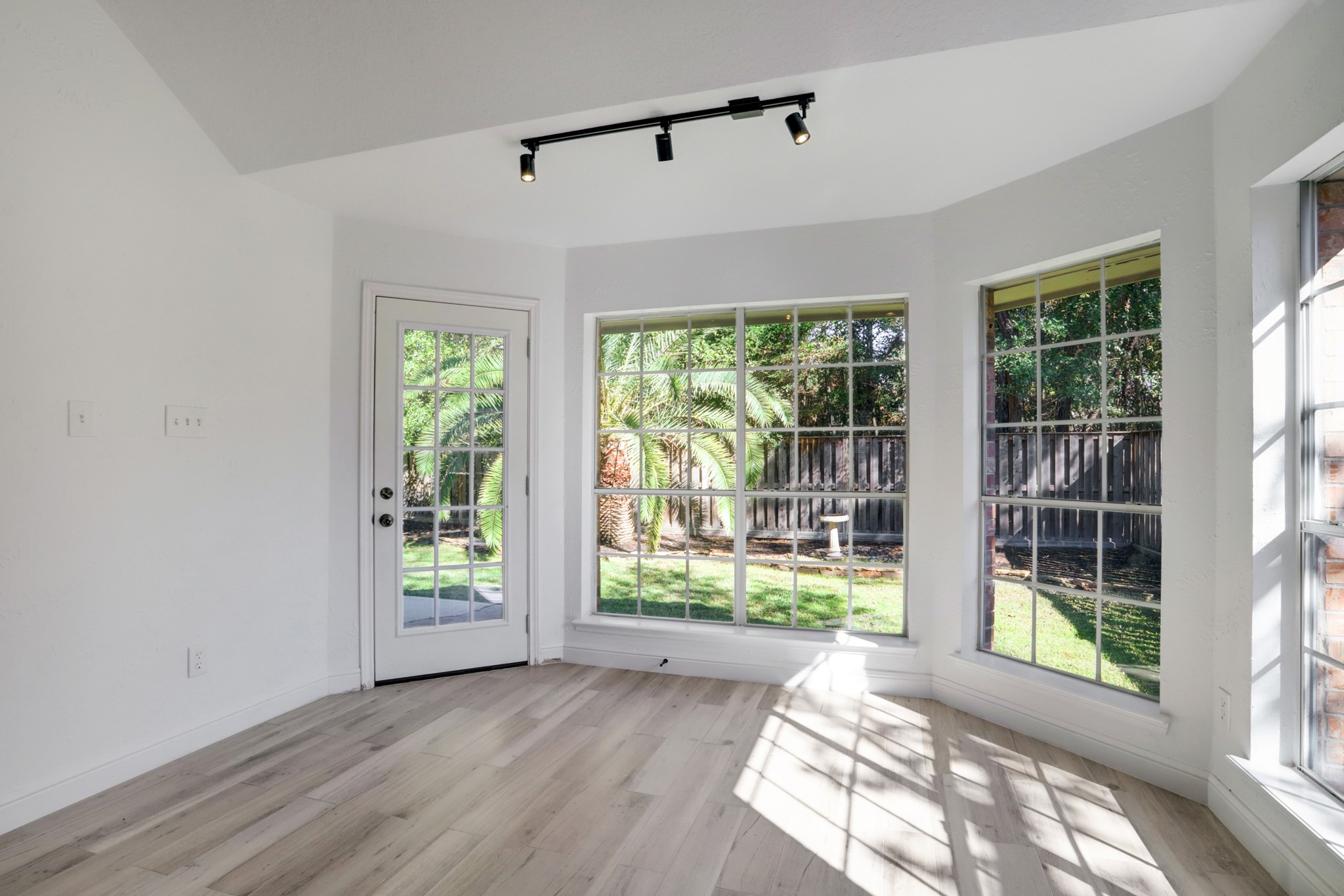 138 Summer Storm Place Spring, TX 77381 - Photo 12 of 20 Sunlit breakfast area surrounded by windows with direct access to the backyard.