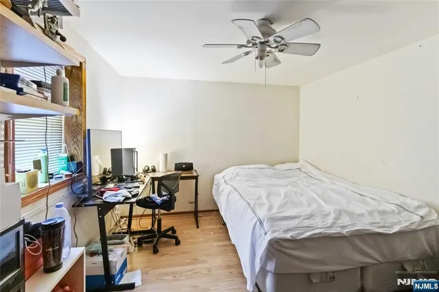 a view of a livingroom with furniture and a ceiling fan