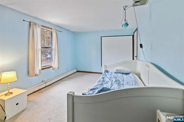 a living room with couch and window