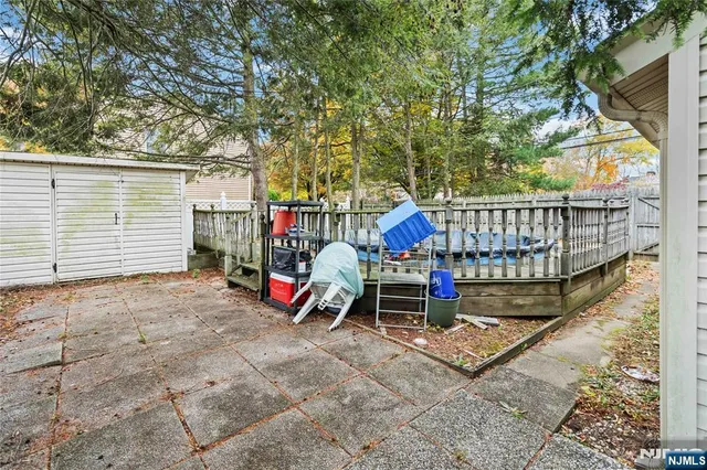a view of outdoor space with seating and lots of trees