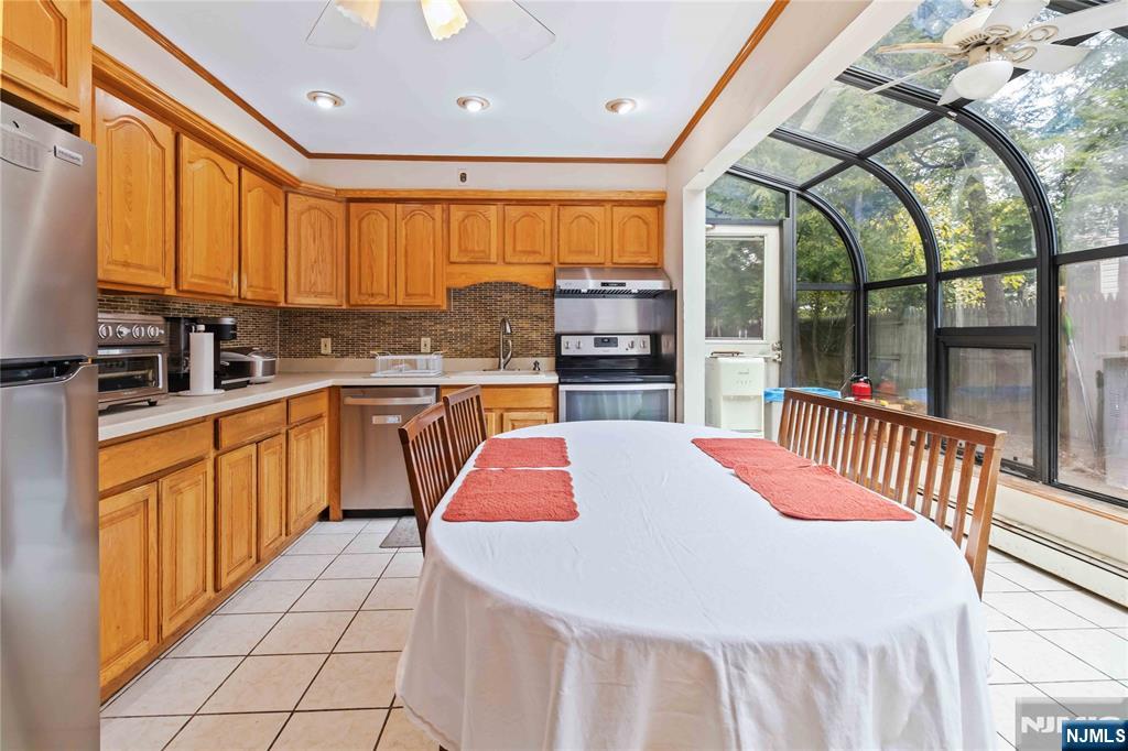 366 Spring Valley Road Paramus, NJ 07652 - Photo 8 of 23 a large kitchen with stainless steel appliances a large window