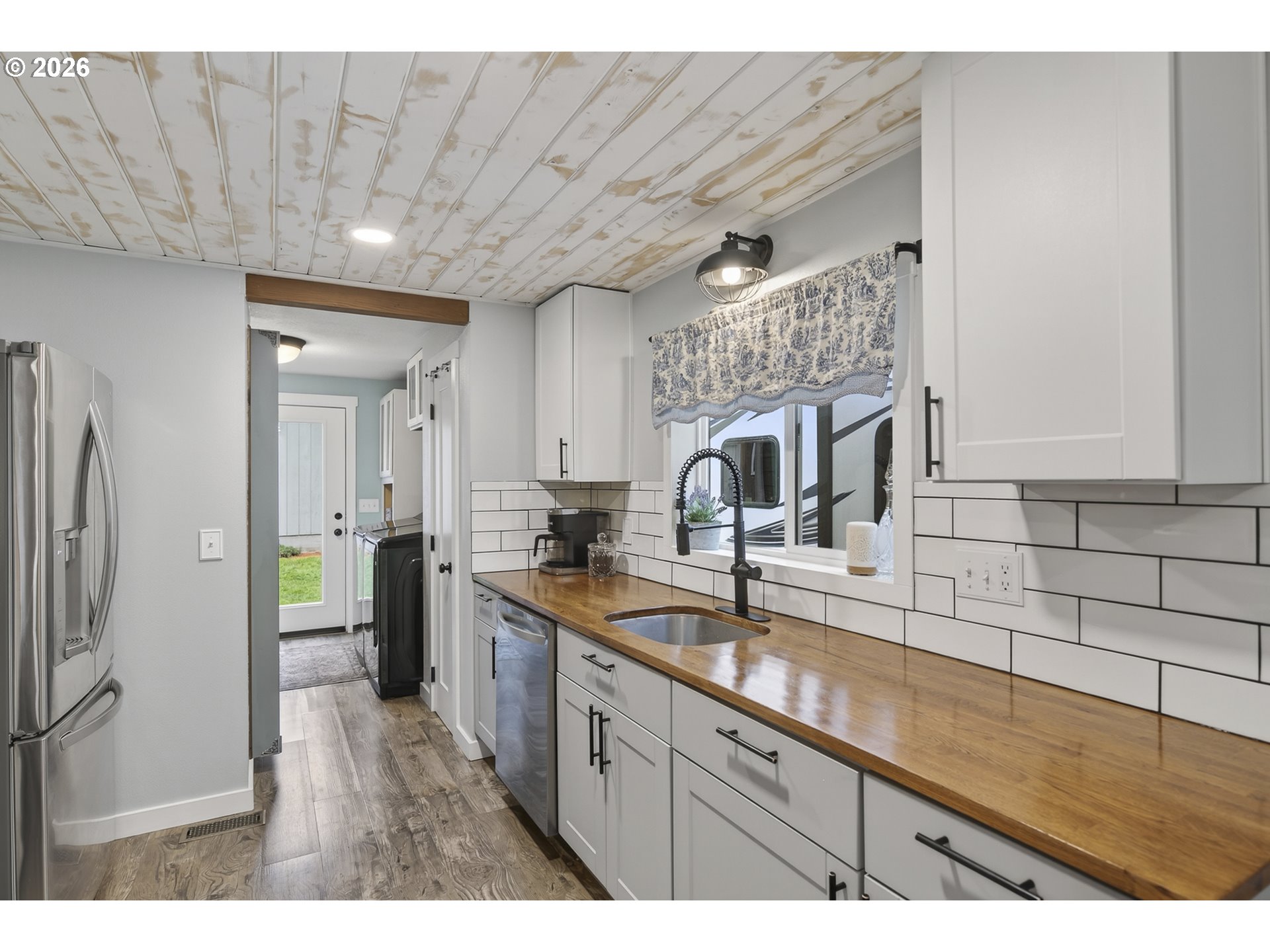 615 Northeast 257th Avenue Camas, WA 98607 - Photo 14 of 48 a kitchen with stainless steel appliances granite countertop a sink stove and refrigerator