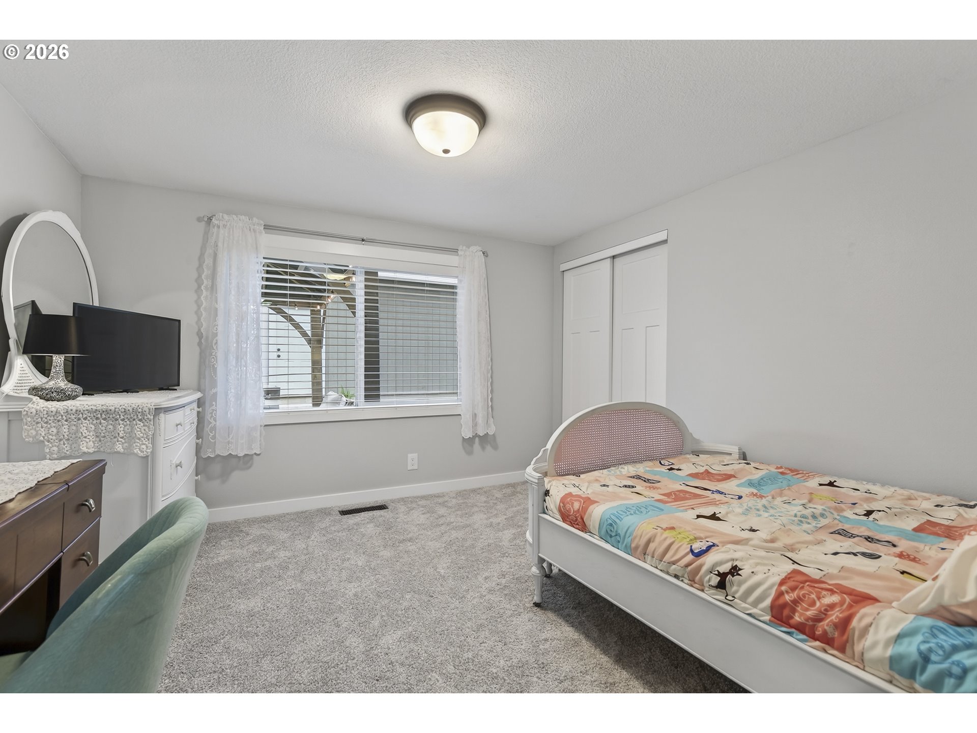 615 Northeast 257th Avenue Camas, WA 98607 - Photo 26 of 48 a bedroom with a bed and a flat screen tv