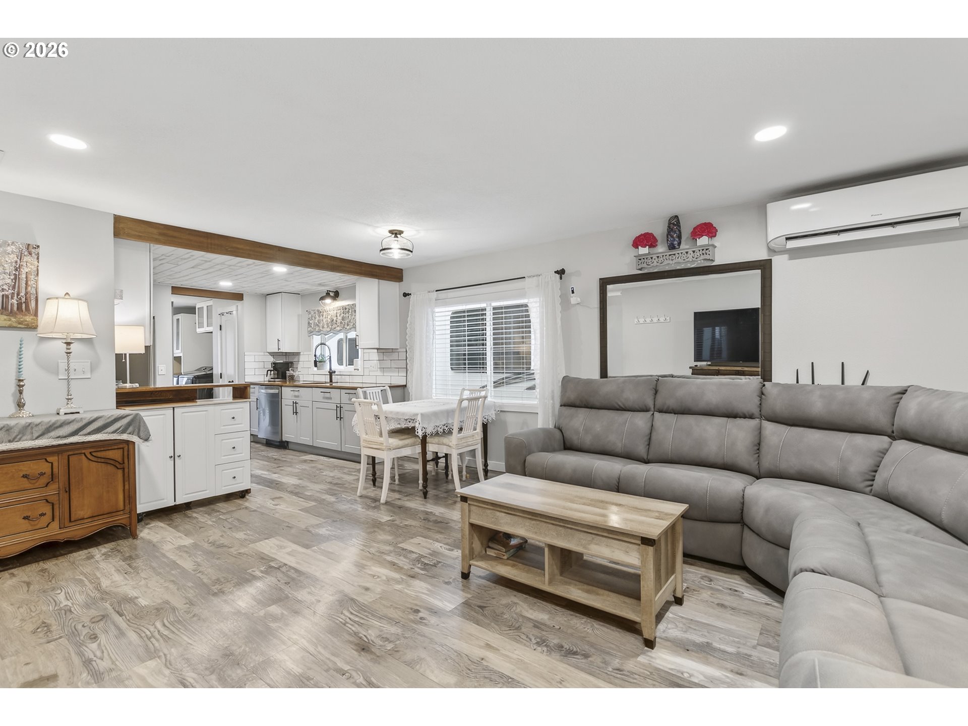 615 Northeast 257th Avenue Camas, WA 98607 - Photo 7 of 48 a living room with furniture white walls and kitchen view
