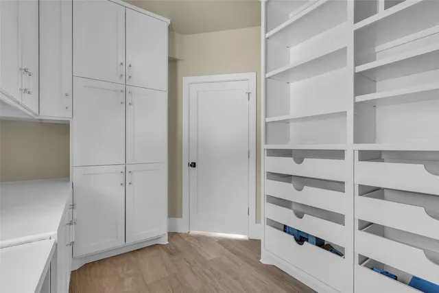 a view of closet area with empty racks