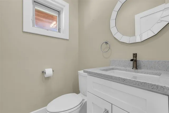 a bathroom with a toilet and a sink