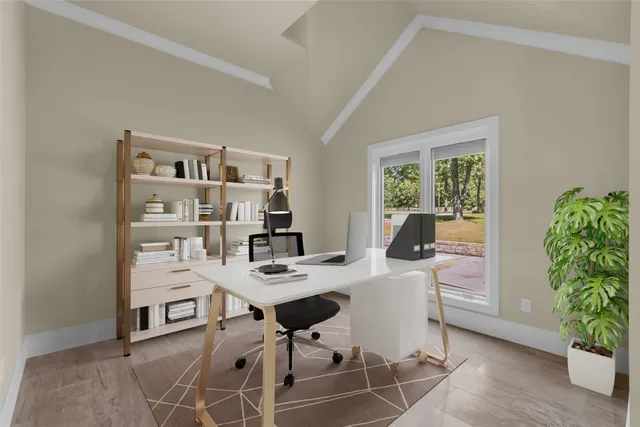 a view of an empty room with a fireplace and a window
