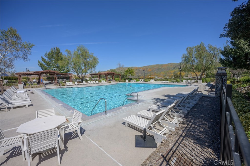 11735 Bunting Circle Corona, CA 92883 - Photo 35 of 38 a view of a terrace with a table and chairs under an umbrella