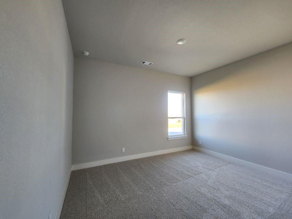 2321 Quartz Street Krum, TX 76249 - Photo 15 of 19 an empty room with windows