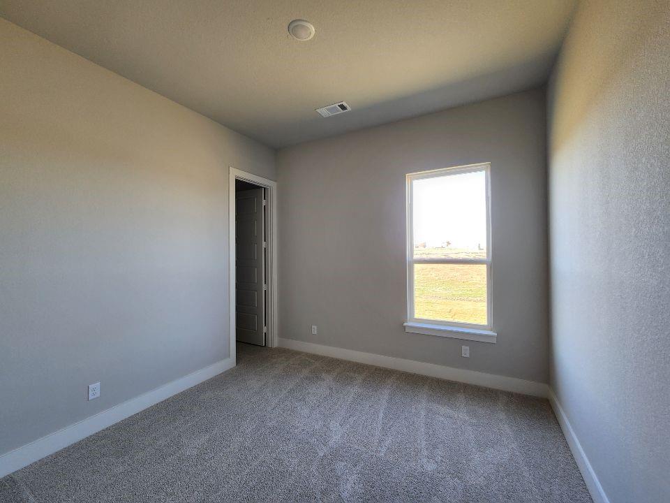 2321 Quartz Street Krum, TX 76249 - Photo 17 of 19 an empty room with a window
