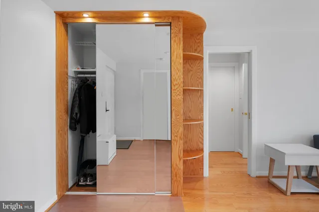 a view of walk in closet with living room