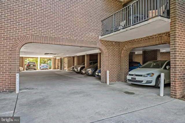a view of a car park in front of house