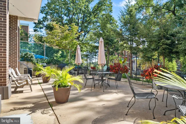 a view of a tables and chairs in a patio